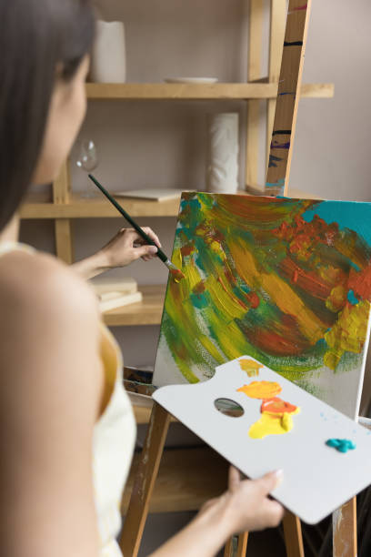 istock Young black haired artist woman practicing art therapy 1480690673
