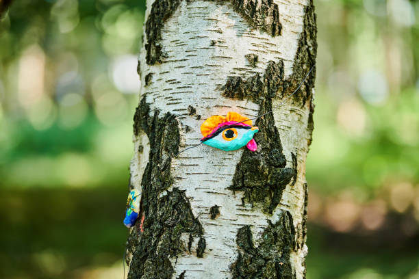 istock Art object of human eyes on tree trunk in green forest background, trees sight feeling ecological concept 1480692471