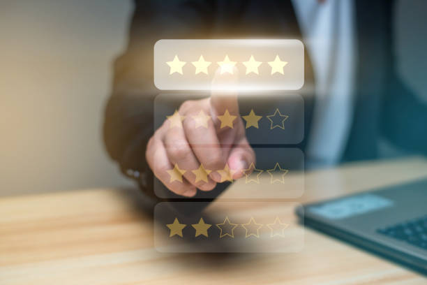 istock Man using laptop and touch virtual screen and give five star symbol to increase rating of product and service concept, Customer satisfaction, selective focus. 1480697767