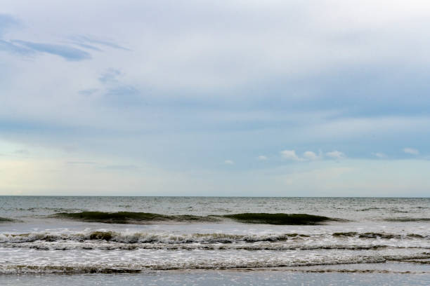 This is a photograph of the Atlantic Ocean in Cocoa Beach, Florida on an overcast day.