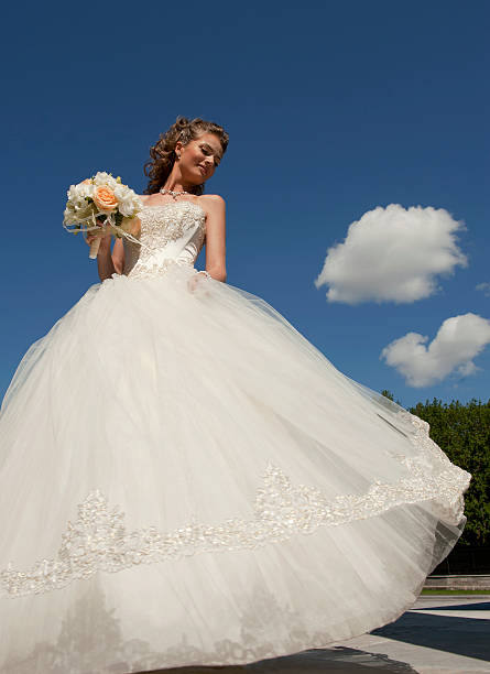 istock Bride with a bouquet and the sky. 148070010