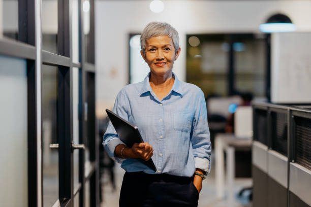 istock Senior businesswoman in office 1480700177