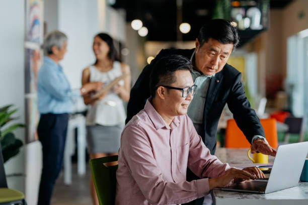 istock Asian businessmen having discussion in office 1480700703