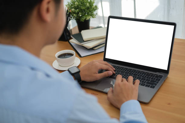 istock Over shoulder view of man freelancer working remote from home with laptop. 1480703622