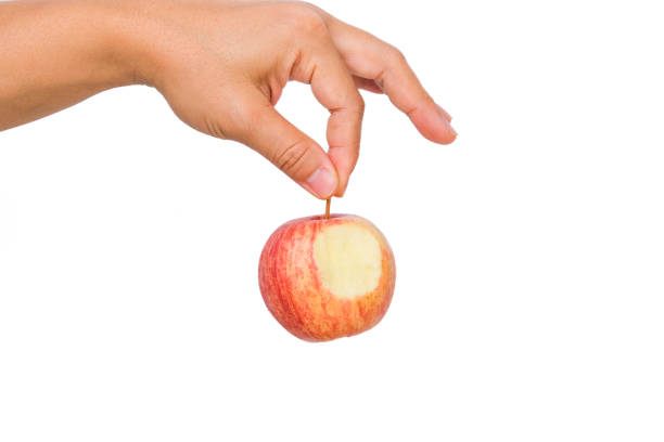 istock Hand holding bite red apple isolated on white background. Ripe red apple in human hand. 1480704770