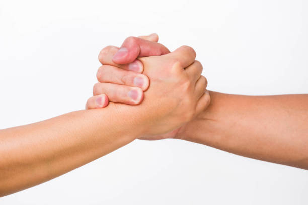 istock Hands of men and women shaking hands. Two people holding hands on white background. That can mean helping, caring, protecting, loving, caring and world peace concept. 1480704792