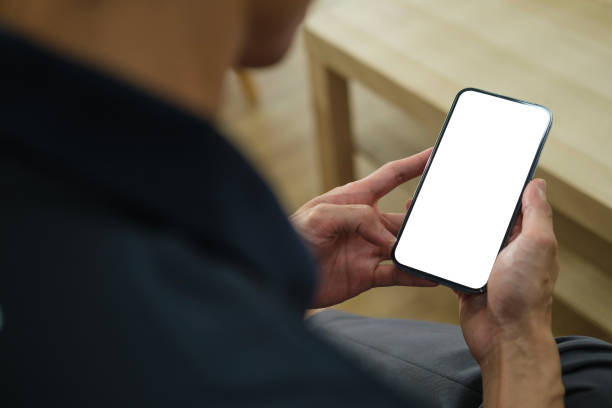 istock Man holding mock up smart phone. Blank screen for your text message or information content. 1480706340