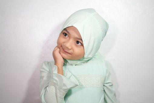 Portrait of a girl wearing hijab and Muslim clothing in the month of Ramadan