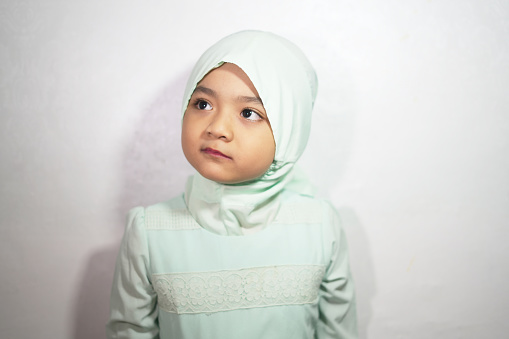 Portrait of a girl wearing hijab and Muslim clothing in the month of Ramadan