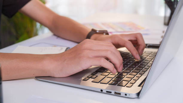 istock Close up view of creative man hands typing on laptop computer. Freelance work, technology and comutication concept. 1480710114