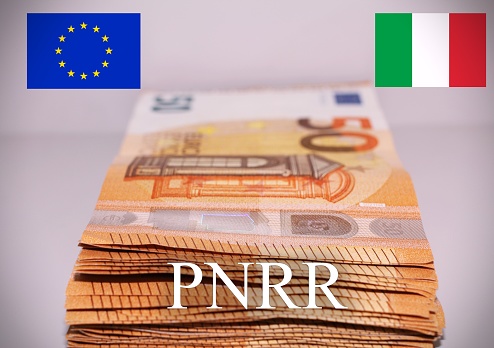 Italian flag and european flag with the sign Pnrr, concept of european financial help