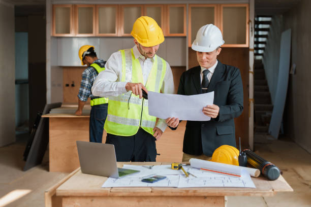 istock multi ethnic engineer brainstorming and measuring for cost estimating on blueprint and floor plan drawings about design architectural and engineering for houses and buildings 1480720010
