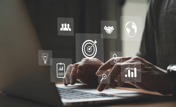 istock Entrepreneur type on keyboard for set business target with big data analytic for online marketing campaign that can increase sale revenue, reach to online marketplace customer. SEO concept 1480720040
