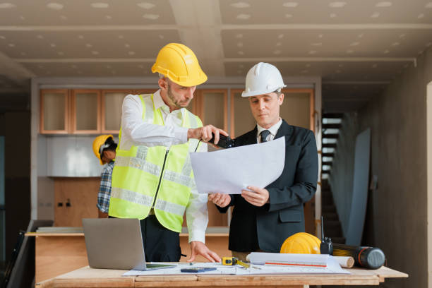 istock multi ethnic engineer brainstorming and measuring for cost estimating on blueprint and floor plan drawings about design architectural and engineering for houses and buildings 1480720067