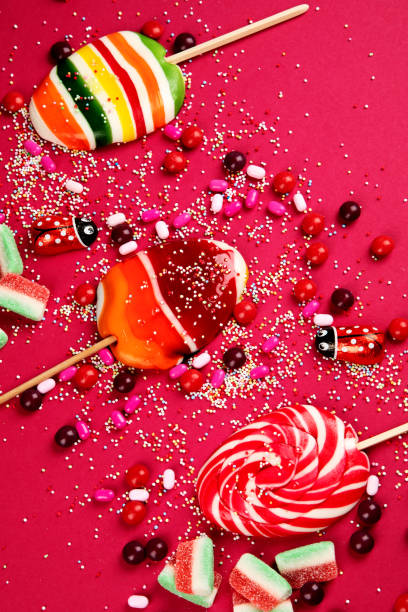 istock Colorful lollipops and different colored round candy. Top view. 1480721033