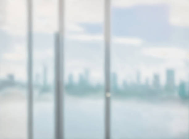 istock Blurred abstract glass wall from building in city town background. 1480721933