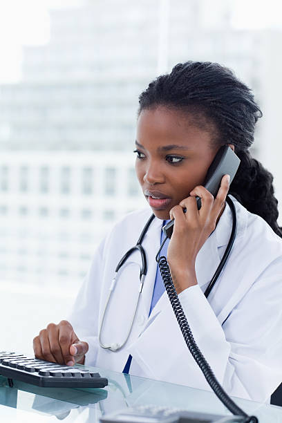 istock Portrait of a female doctor using her computer 148072277
