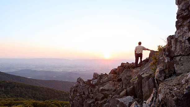 istock Senior man watches sunrise over blue ridge 148072437