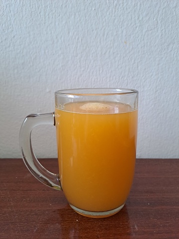 Morning shot with orange squeeze, honey and kombucha