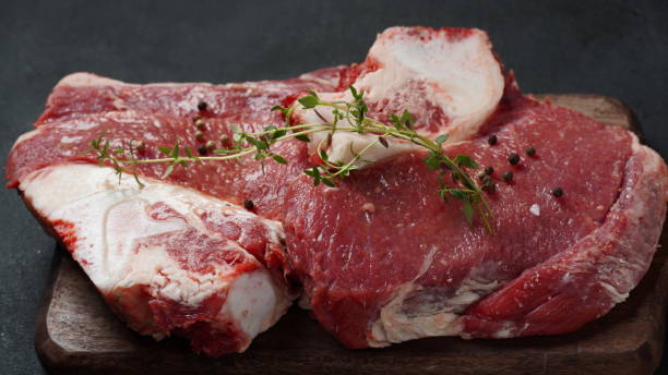 istock Fresh raw beef meat on the board with herbs and spices ready for cooking 1480728083