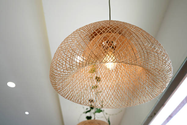 Wicker Pendant Lamp, rattan ceiling pendant lamp hangs on ceiling. stock photo