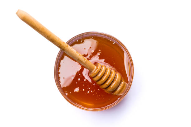 istock Jar of honey and honey spoon 1480729096