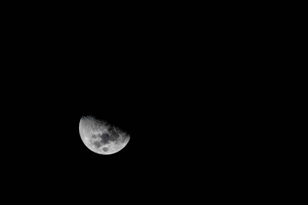 Low angle view of moon against sky at night