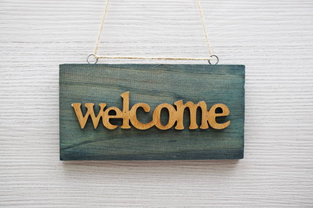 istock Welcome Sign hanging on wooden background 1480738361