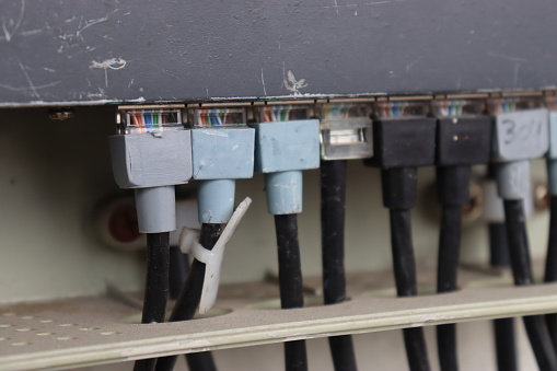 Close-up of Ethernet cable plugged into router for fast and reliable internet. Connectivity Network panel, switch and cable in data center
