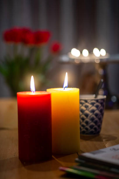 istock One red and one yellow candle. 1480751603
