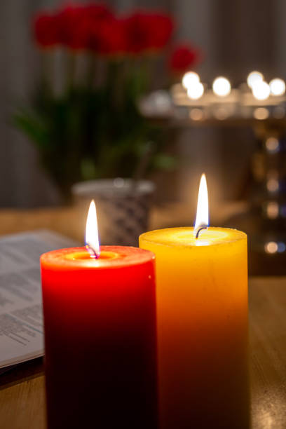 istock One red and one yellow candle. 1480751627
