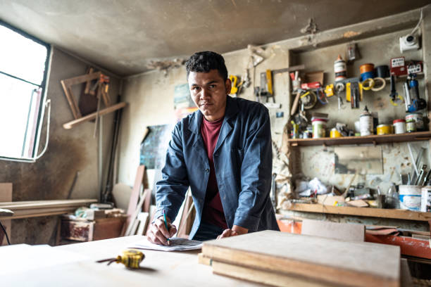 istock Portrait of a young carpenter working at carpentry workshop 1480751948