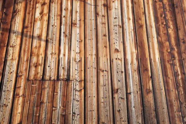wooden wall made of brown weathered boards