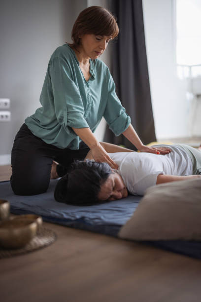 istock Woman enjoying Shiatsu back massage 1480755036