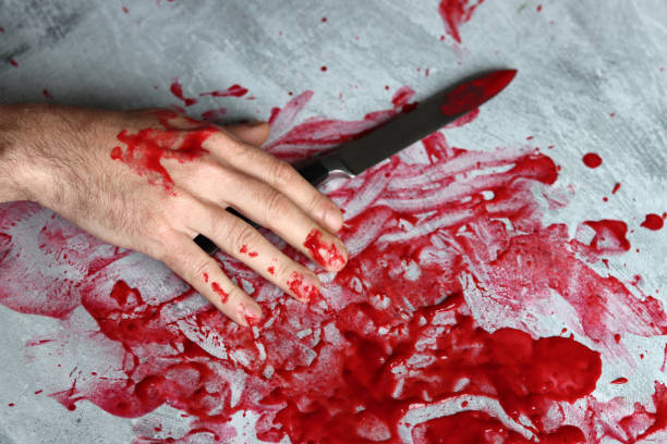 istock Bloody hand with knife 1480756640