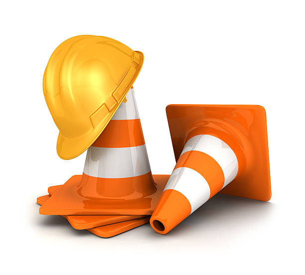 istock 3d traffic cones and a safety helmet 148076339