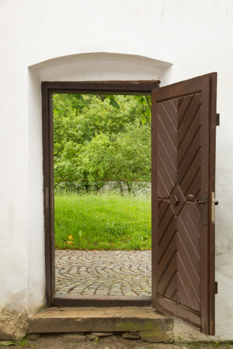 Old door in monastery leading to the garden