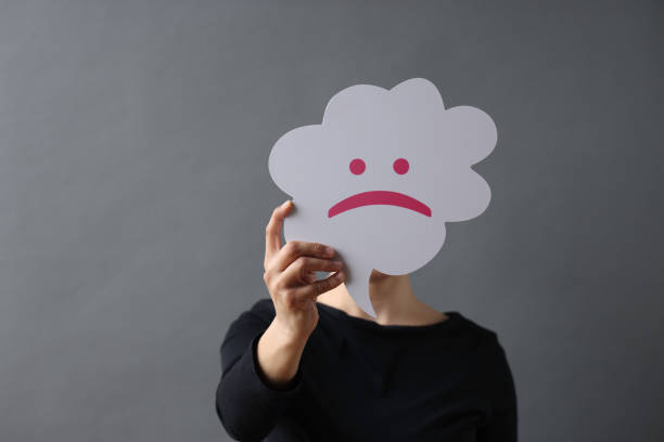 istock Woman holding speech bubble with cry emoji 1480775162