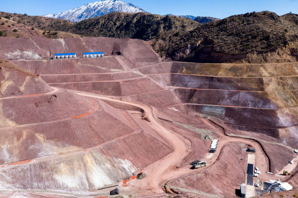istock View of the tailings dam or waste dam construction and sealing membrane assembly for mining plant with snowy weather. 1480788100