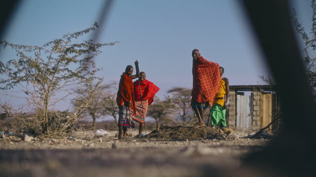 SLO MO Samburu men gathers in the village
