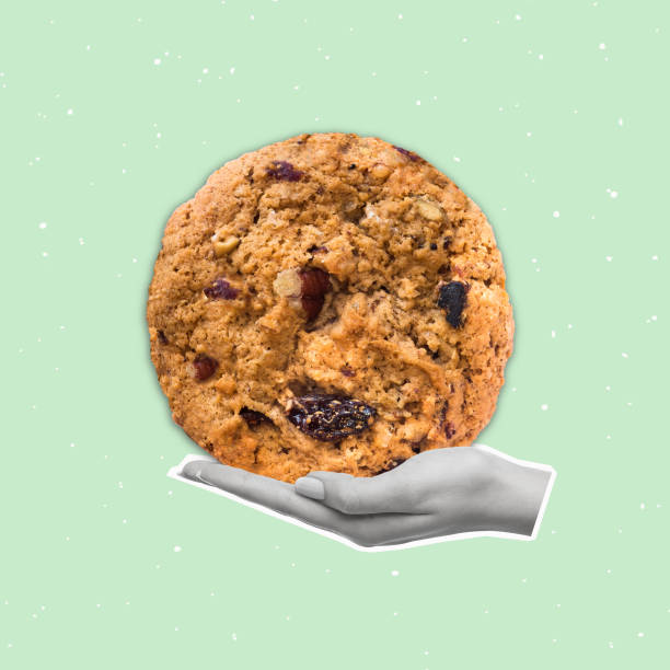 Contemporary art collage of hand holding a cookie.