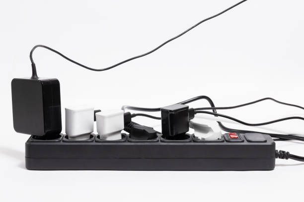 istock Black extension cord with many plugs on white background 1480800110