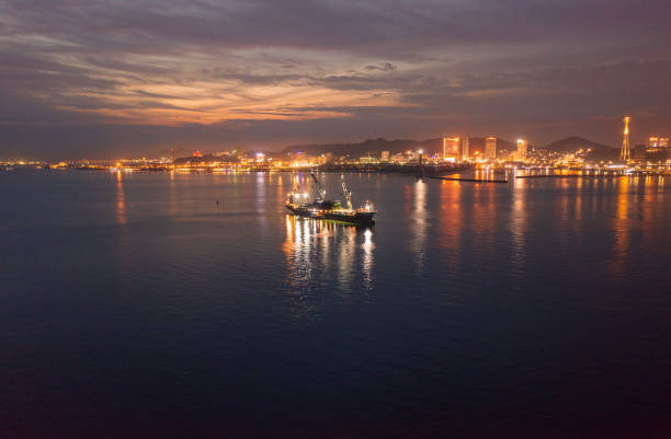 istock Heavy logistic cargo ship on Ha Long bay in sunset 1480808015