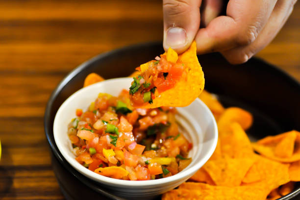 istock nachos, Nachos Cheese or Mexican snacks with tomato salad 1480811142