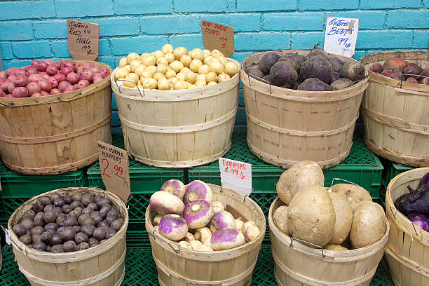 Baskets of beets, turnips, potatoes and other vegetables at the market.