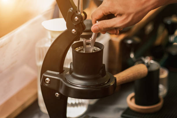 istock Barista preparing coffee using chemex pour over coffee maker and drip kettle. Man making coffee. Alternative ways of brewing coffee. Coffees shop concept, good quality beans 1480813922