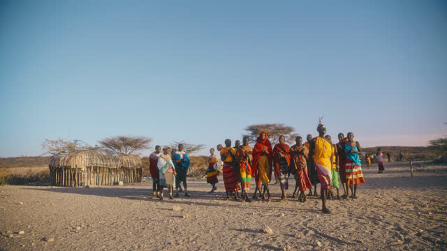 SLO MO Samburu warriors in local dresses performs local dance