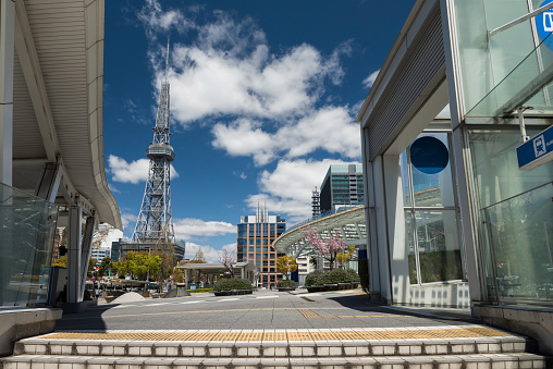 Subway train station to Oasis21, Nagoya TV tower, and Odori park with cherry sakura tree in spring againt blue sky and cloud.  Famous travel and shopping destination in Aichi, Chubu.