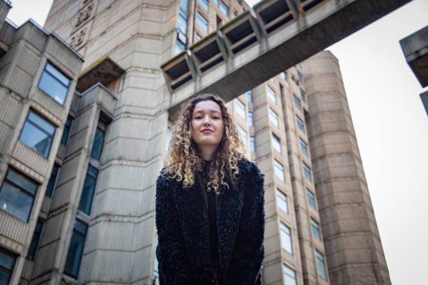 istock Girl in front of a building 1480816489