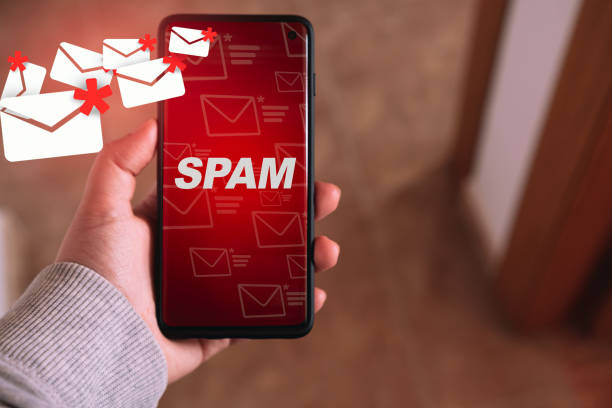 Protect spam mail from internet cyber security. Woman showing mail spam on her smartphone. Communication business technology. phone spam stock pictures, royalty-free photos & images